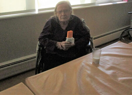 Resident holding ice pop