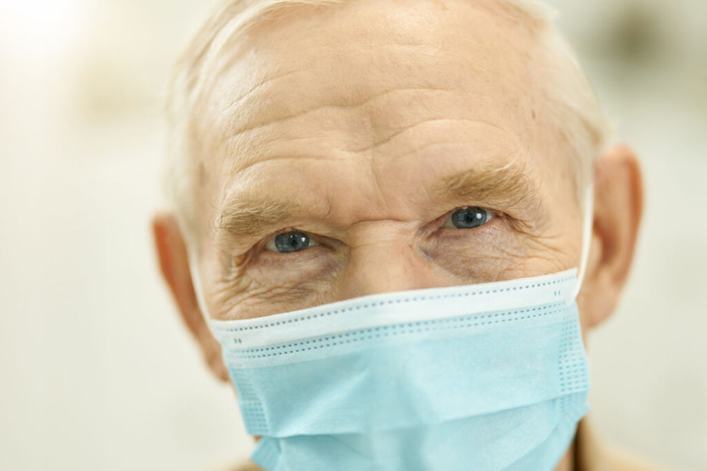senior male wearing protective face mask