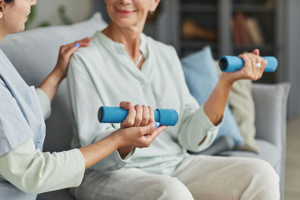 older adult female in a physical therapy session