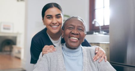 Young girl holding shoulder of older woman